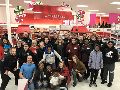 cops n' kids holiday shopping 2018 group photo with kids and cops