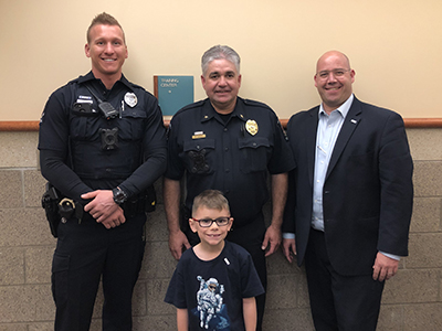 2019 Mayor for a Day Danny with Mayor Spano, Police Chief Harcey and a police officer