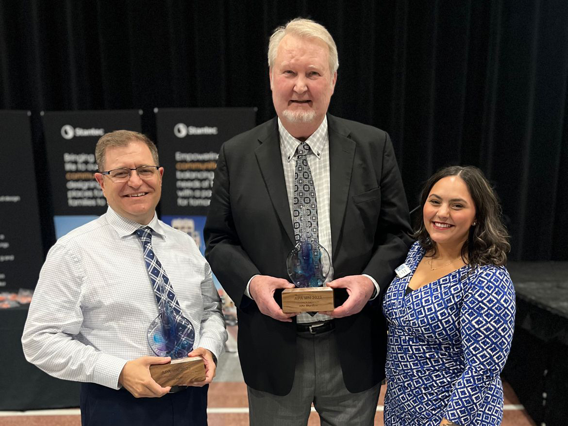 Sean Walther holding mnAPA award