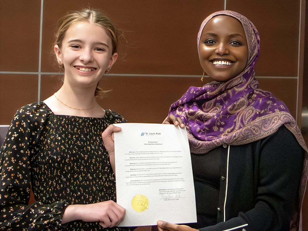 may for the day essay winner Claire Westlund with Mayor Nadia Mohamed