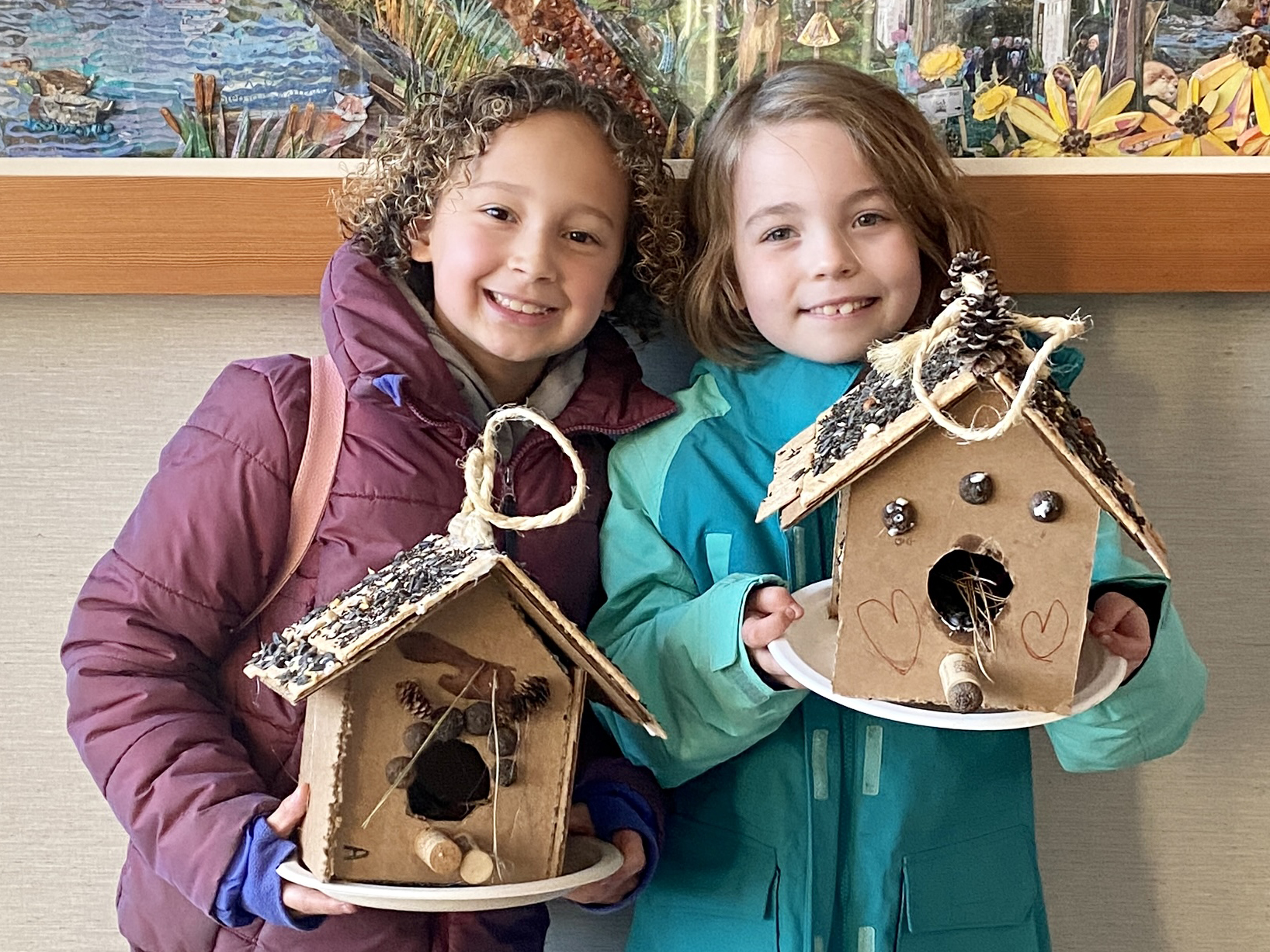 girls holding ginger bird houses